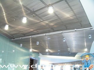 fire-sprinklers-on-the-suspende-decorative-stainless-still-ceiling