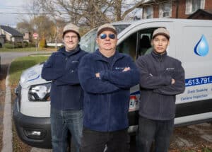 Dr. Pipe plumbers arriving for trenchless pipe repair service in Toronto