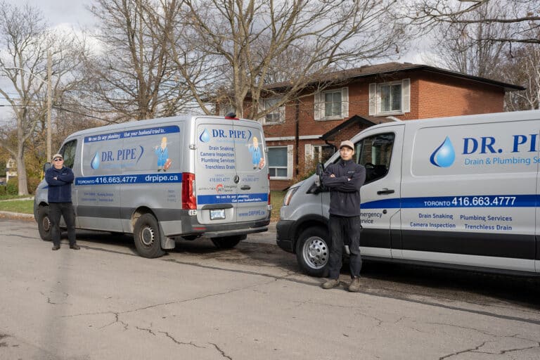 Dr. Pipe technicians with service vans for catch basin cleaning in Toronto