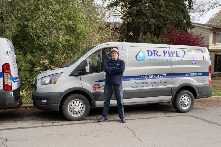 Dr. Pipe technician in front of a service van for drain line video inspection in Toronto