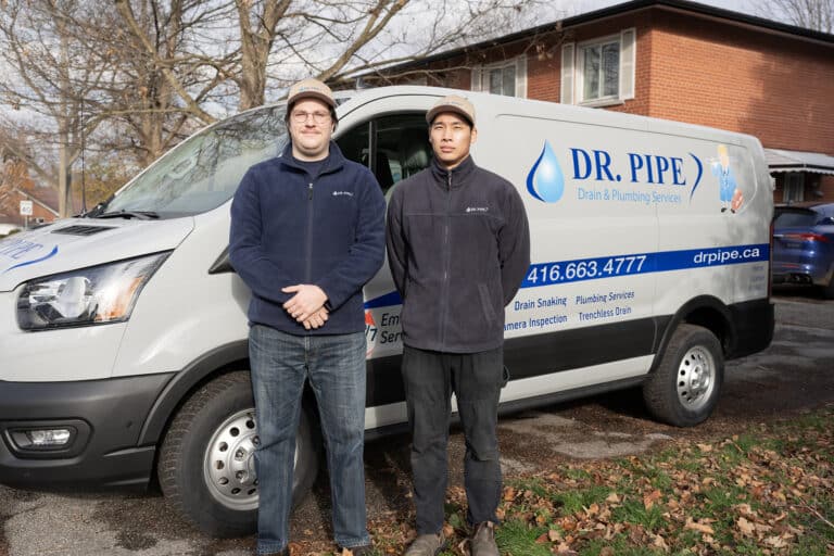 Dr. Pipe technicians in front of a service van for emergency plumbing service in Toronto