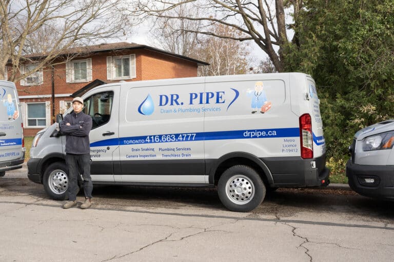 Dr. Pipe technician in front of a service van for frozen pipe service in Toronto