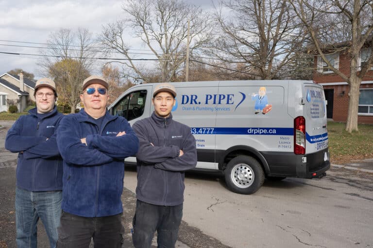 Dr. Pipe technicians in front of a service van for pipe bursting in Toronto