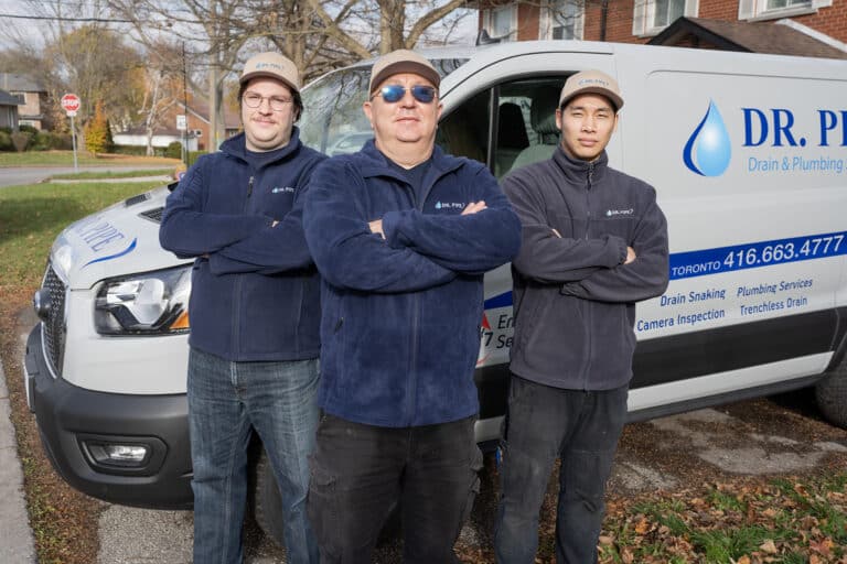Dr. Pipe technicians in front of a service van for trenchless sewer line repair in Toronto